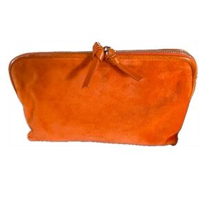 Bottega Veneta orange suede clutch. NWOT. Pristine.